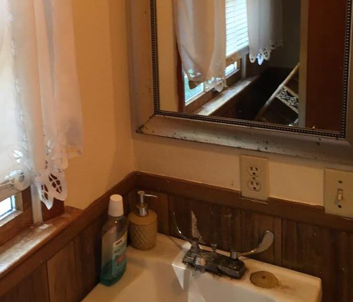 mirror, old stained sink.