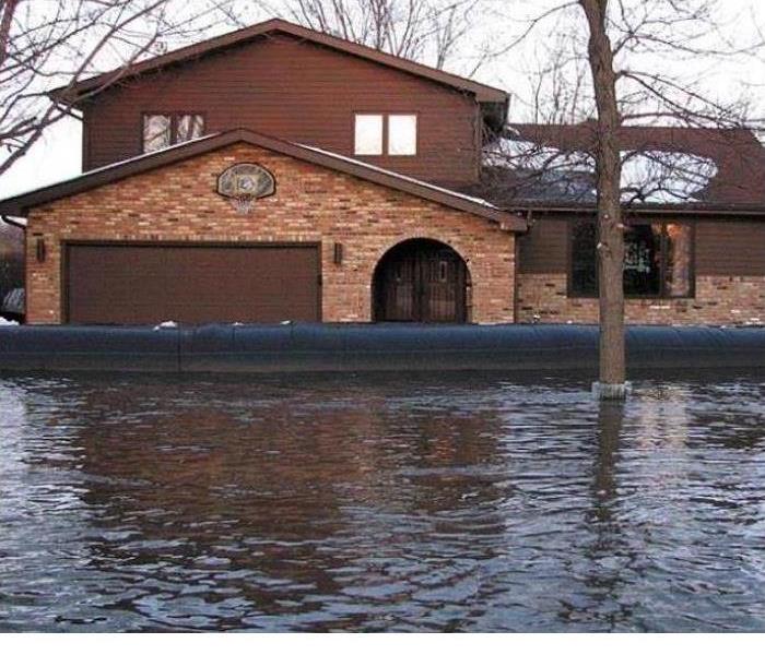 flood waters surrounding a home 