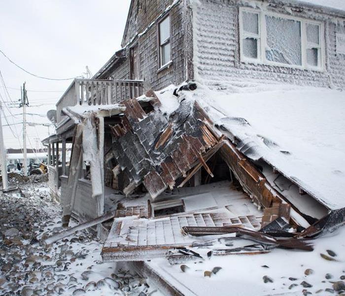 House collapsing due to snow piling up on the roof  